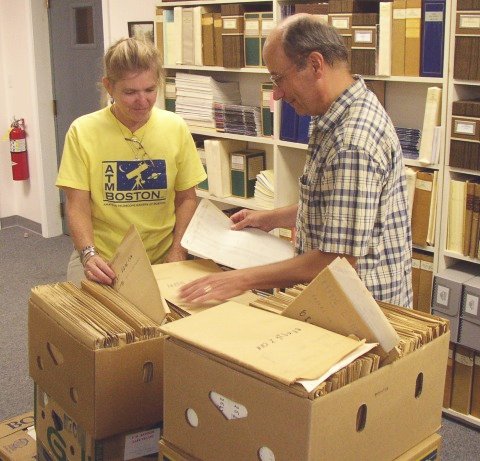 AAVSO staffers Ginny Renehan and Mike Saladyga inspect the newly-arrived RASNZ archive